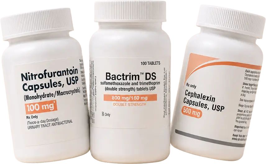 Prescription bottles of nitrofurantoin, Bactrim DS, and cephalexin antibiotics